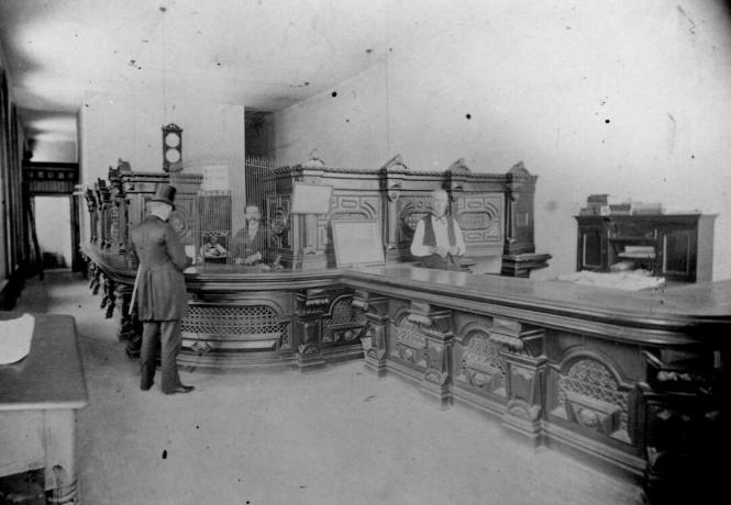 O. Henry como empleado bancario en First National Bank en Austin, Texas