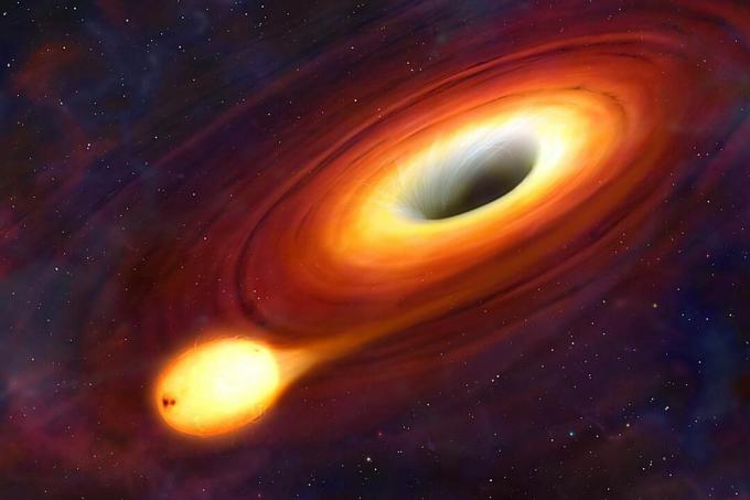 Un agujero negro es un objeto tan compacto que nada puede escapar de su atracción gravitacional. Ni siquiera la luz. En la Tierra, un objeto necesita ser lanzado con una velocidad de 11 km / s para escapar de la gravedad del planeta y entrar en órbita. Pero la velocidad de escape de un agujero negro excede la velocidad de la luz. Como nada puede viajar más rápido que esta velocidad máxima, los agujeros negros absorben todo, incluida la luz, lo que los hace completamente oscuros e invisibles. En esta imagen, podemos ver un agujero negro, pero solo porque está rodeado por un disco de material sobrecalentado, un disco de acreción. Cuanto más cerca del agujero se acerca el material, más y más de su luz se captura, por lo que el agujero se vuelve más oscuro hacia su centro.