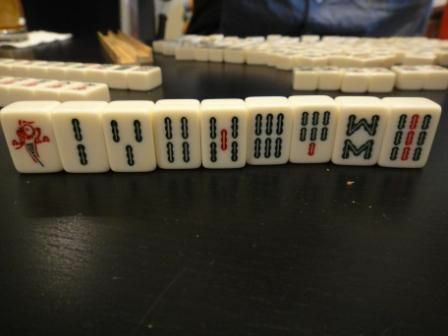 El traje de bambú de un juego de fichas Mahjong.